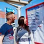 Couple looking at Bus Stop Timetable.jpg